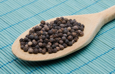 Pepper in a wooden spoon