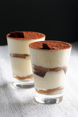Traditional Italian dessert tiramisu in a glass