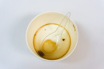 close up of spilled coffee on white background