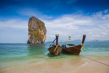 Fototapeta na wymiar Tropical beach, traditional long tail boats