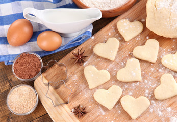 Making cookies on wooden background