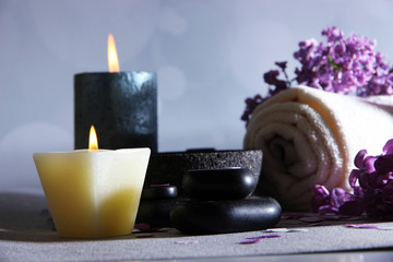 Composition with spa treatment, towels and lilac flowers,
