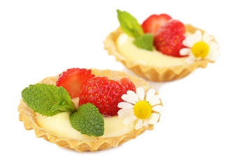 Tasty tartlets with strawberries isolated on white
