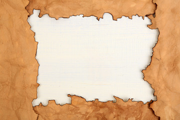 Frame of old paper on wooden background