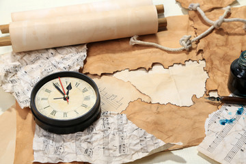 Old paper with vintage accessories on wooden background