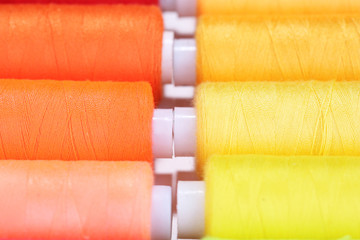Multicolor sewing threads background