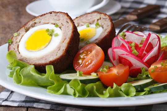 Meat stuffed with egg and vegetable salad