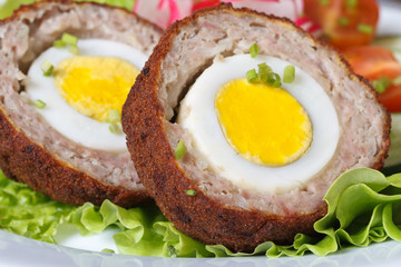 Healthy breakfast of meat stuffed egg on the lettuce