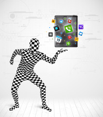 man in full body suit holdig tablet pc