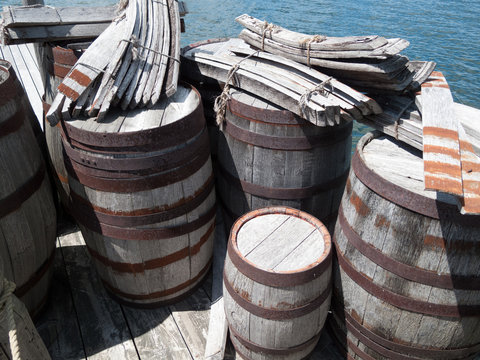 Wooden barrels at a pier