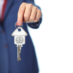 Hand with a house key.