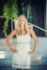 young blonde woman posing in the streets