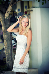 Fototapeta premium young blonde woman posing in the streets