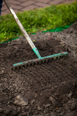 photo of rake on garden bed
