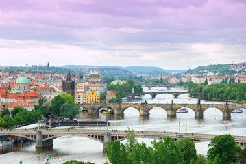 Fototapeta na wymiar Prague and its multiple bridges across Vltava river