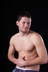 Fototapeta premium Handsome man with stomach ache