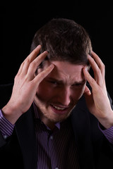 Fototapeta premium Businessman feeling migraine