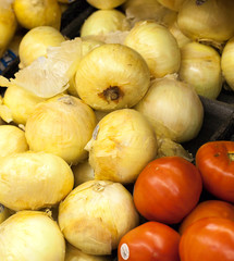 Onions and tomatoes for sale at a market stall