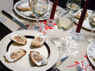 Oysters and white wine served in candlelight dinner