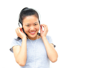Naklejka premium happy beautiful young asian woman enjoying the music