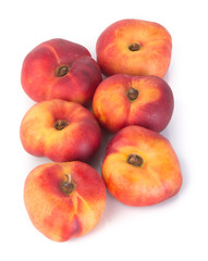 flat peaches (donut peaches) on a background