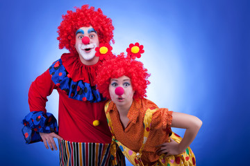 Clown couple on blue background