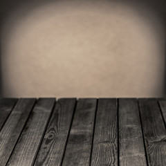 Old wooden rustic table in a grunge room