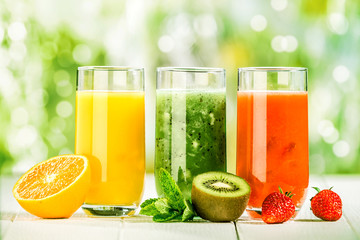 Trio of fresh healthy fruit juice blends