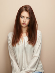 Portrait of young beautiful girl with brown hair.