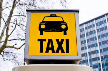 Taxi sign with car
