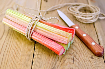 Rhubarb with coil of rope and knife on board