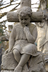 The statue of the boy.