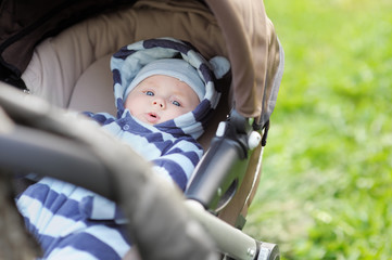 Little baby boy in stroller