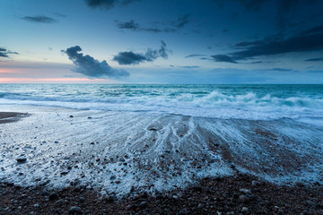 Atlantic ocean beach at dusk