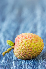 Fresh lychee on a wooden background