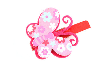 Pink of artificial butterfly hairpin isolated on white.