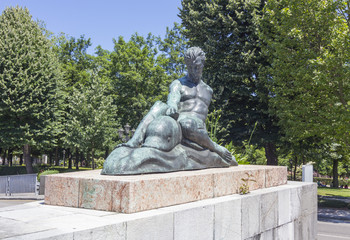 statue of a man riding on a dolphin