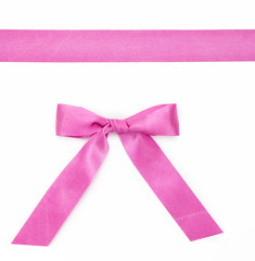 Pink ribbon with a bow isolated on white background
