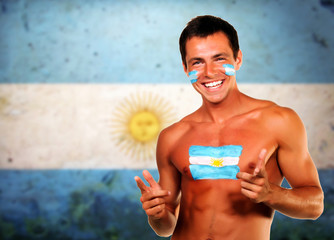 Cheering argentinian soccer fan over argentina flag background