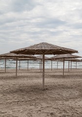 Sun umbrellas on empty beach