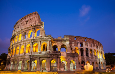 Fototapeta na wymiar The Coliseum at night in Rome, Italy