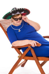 Mature woman relaxing on a lounger