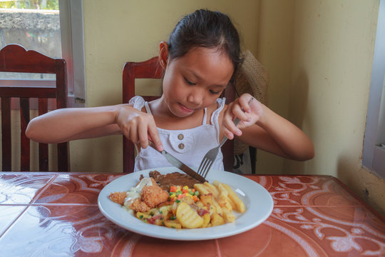 Girl Eating Steak