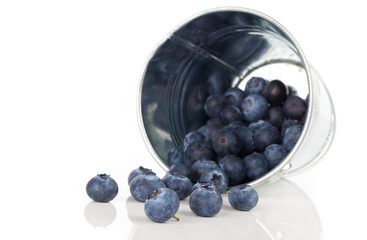 blueberry berries in a metal bucket, isolated on white backgroun
