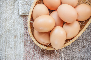 Easter egg in a basket  on wodden table