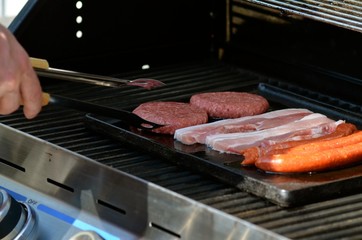 turning meat on grill