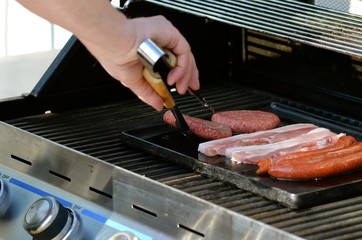 turning meat on grill