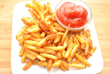 Spicy Fries Served on a White Plate with Catsup