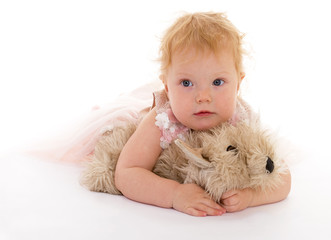 pretty little girl with a toy dog.