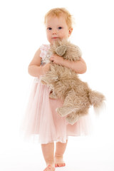 pretty little girl with a toy dog.